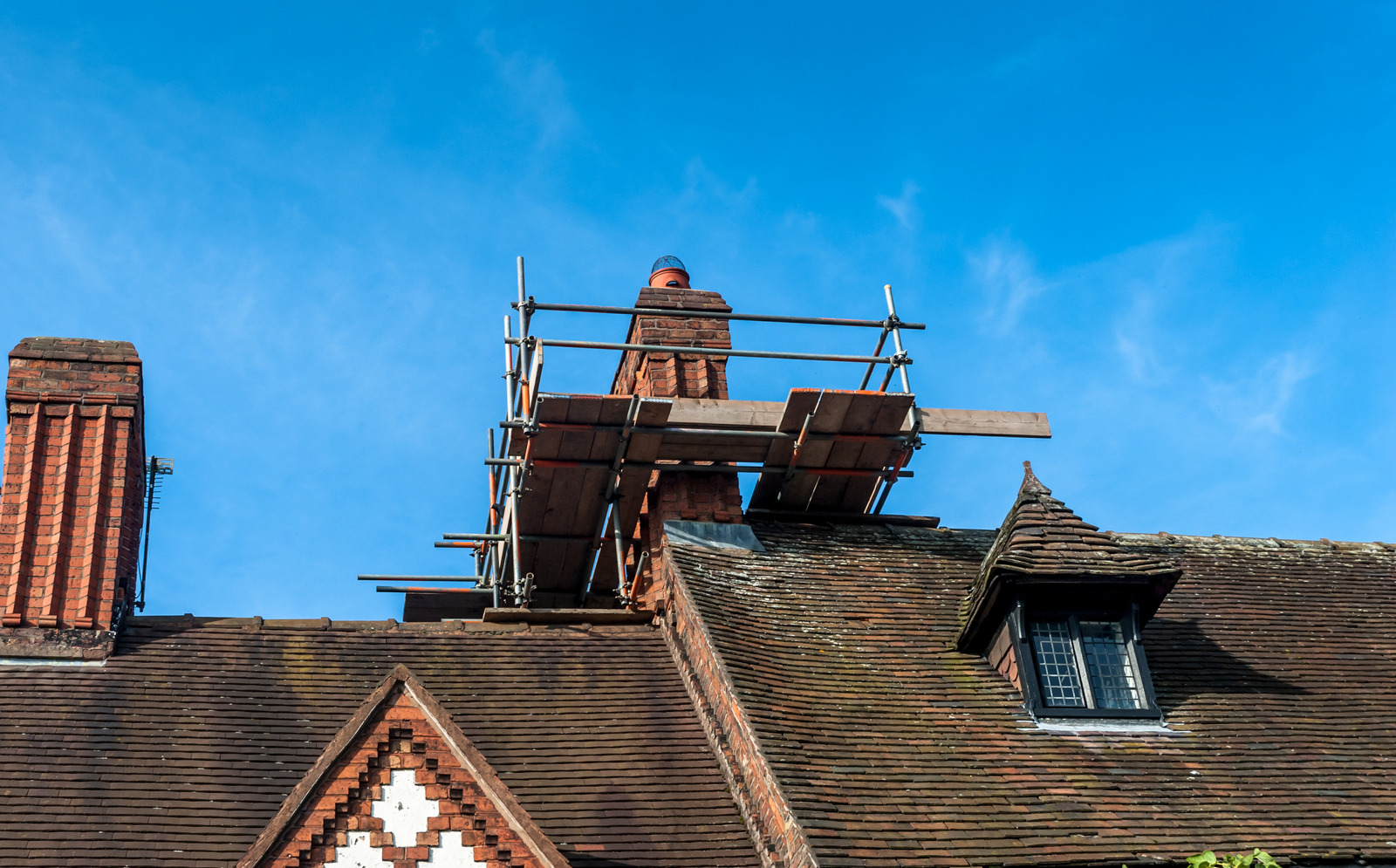 . Dr Sweep installs a new chimney cap on masonry chimney